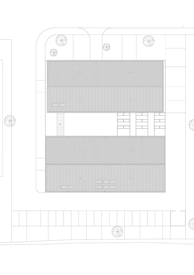 Roof plan drawing depicting two gabled volumes with vertical cladding and three stair cores between them