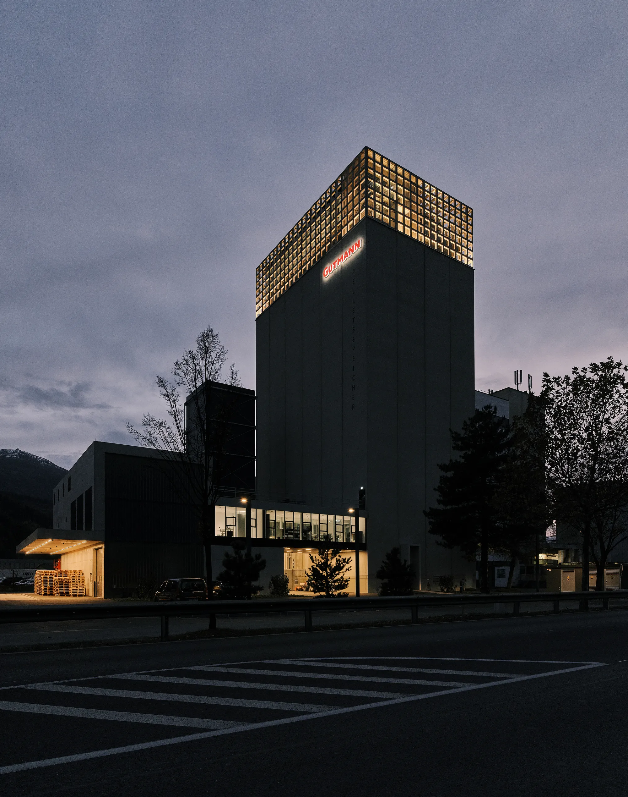 Two Firms Crown a 1978 Grain Silo in Tirol with Offices, Art, and a Biomass Power Plant