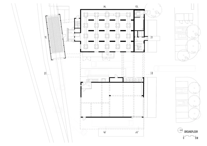 Ground floor plan drawing showing office spaces, large production hall, and adjacent structures
