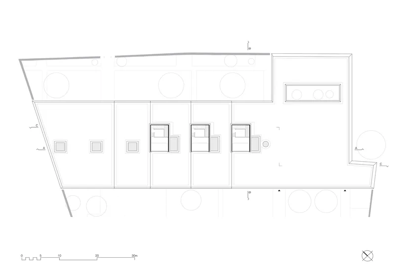 Floor plan drawing showing three tall volumes with window groupings along an outdoor terrace