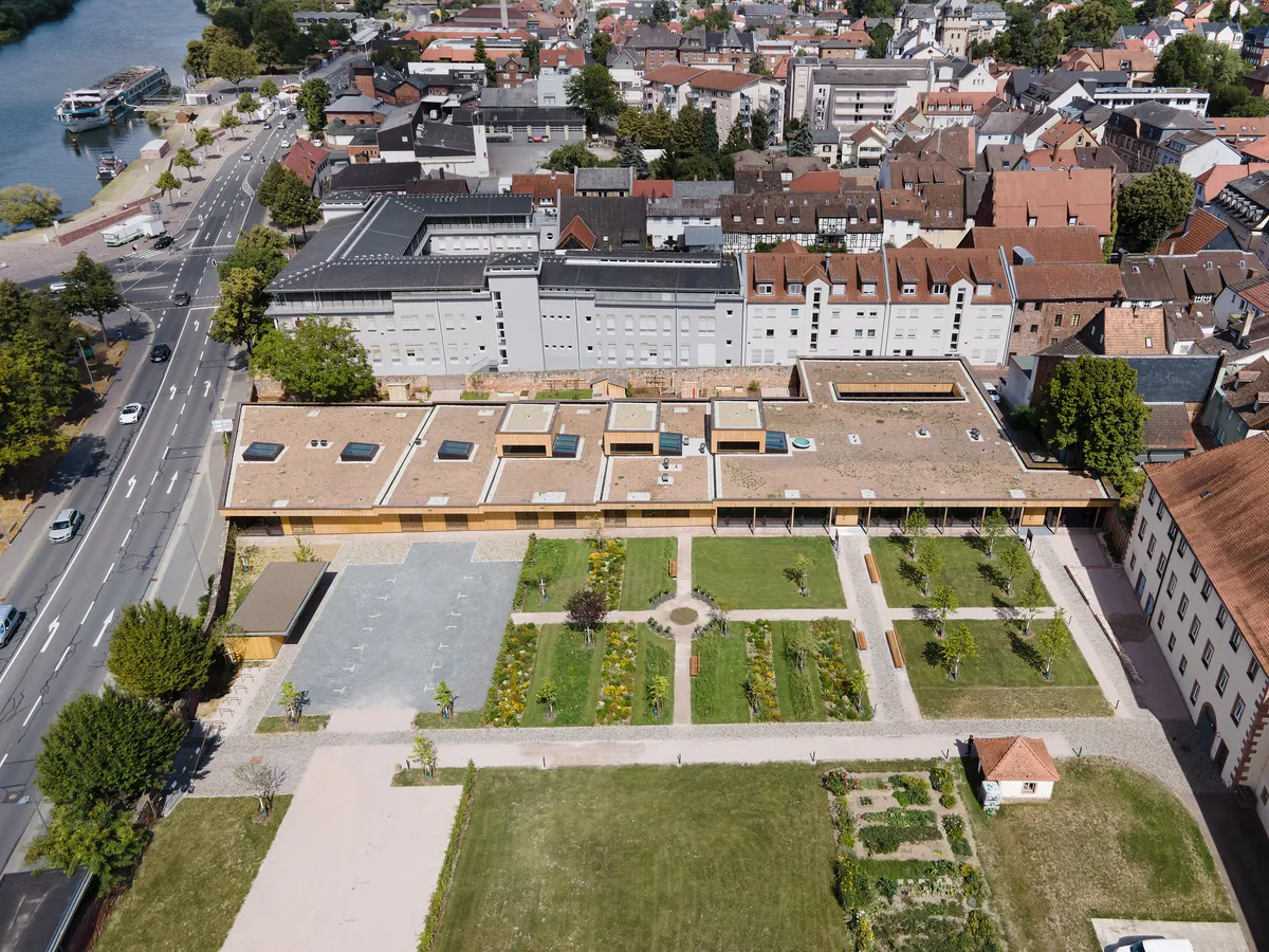 Bez and Kock Architekten Nest a Timber Daycare Pavilion Inside a 17th-Century Monastery Garden