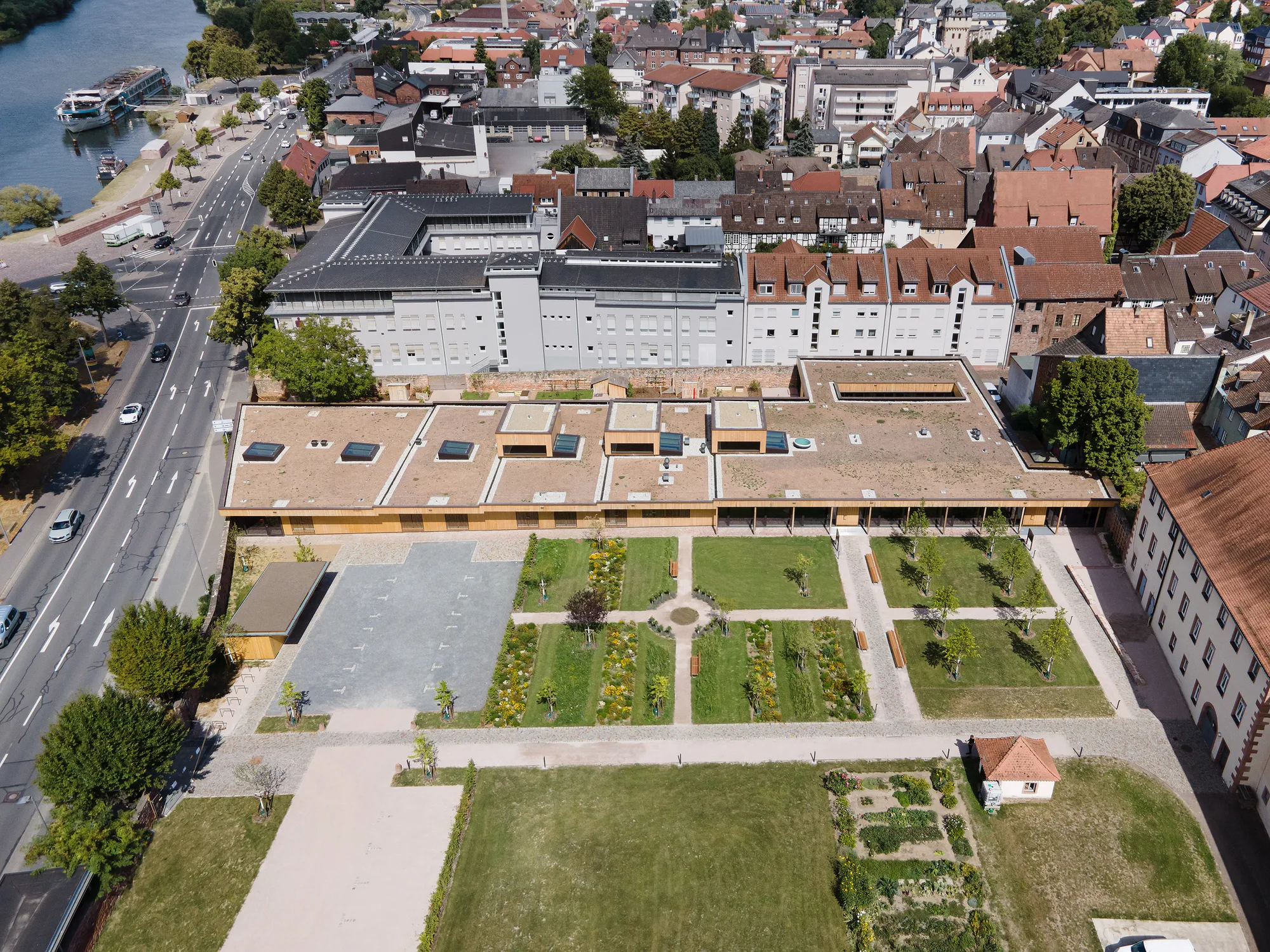 Bez and Kock Architekten Nest a Timber Daycare Pavilion Inside a 17th-Century Monastery Garden