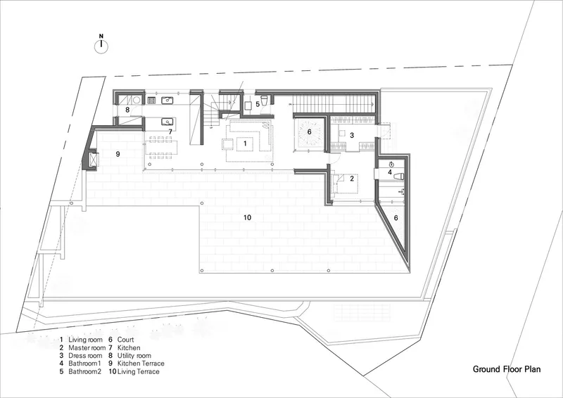 Ground floor plan drawing showing living spaces kitchen and large terrace wrapping the north side