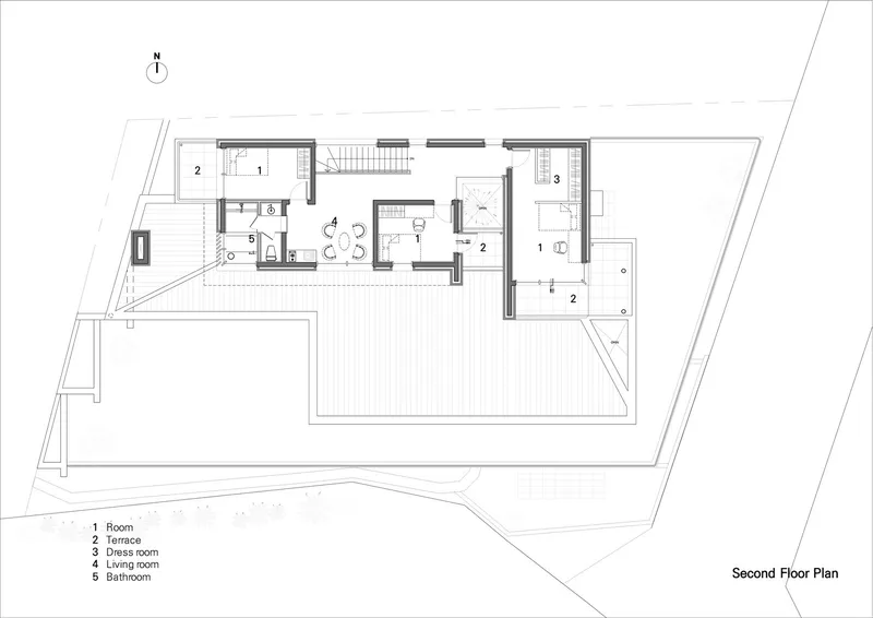 Second floor plan drawing showing bedroom clusters and roof terrace areas with central circulation