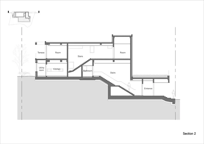Section drawing showing split-level interior with cascading stairs connecting multiple floors carved into sloped terrain