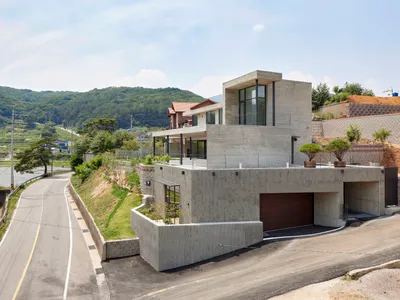 SMxL Architects Carve a Concrete Panorama House into a Korean Hillside