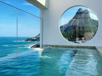 Siqueira + Azul Arquitetura Frame the Atlantic Through Circular Portals at Janeiro Hotel