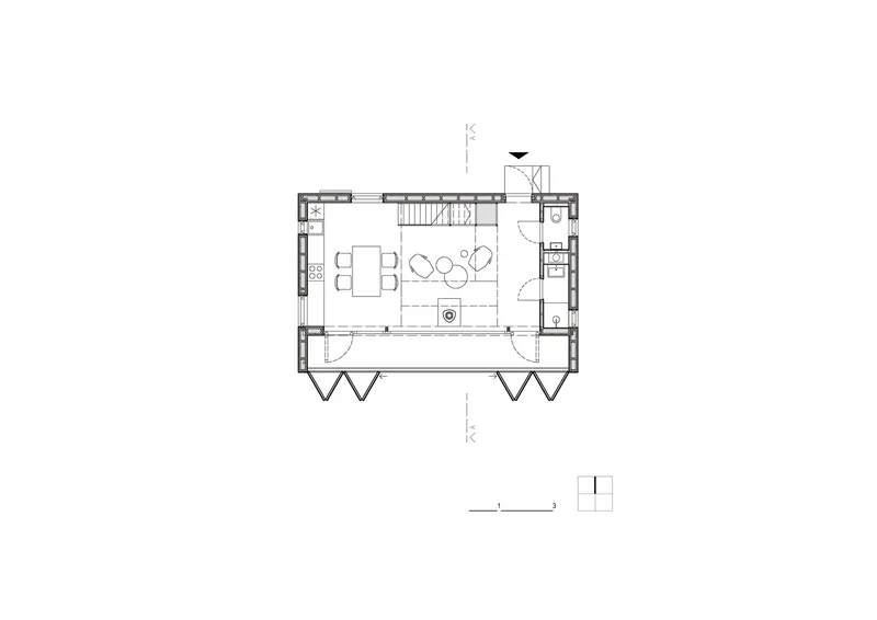 Floor plan drawing showing an open living and dining space with central fireplace