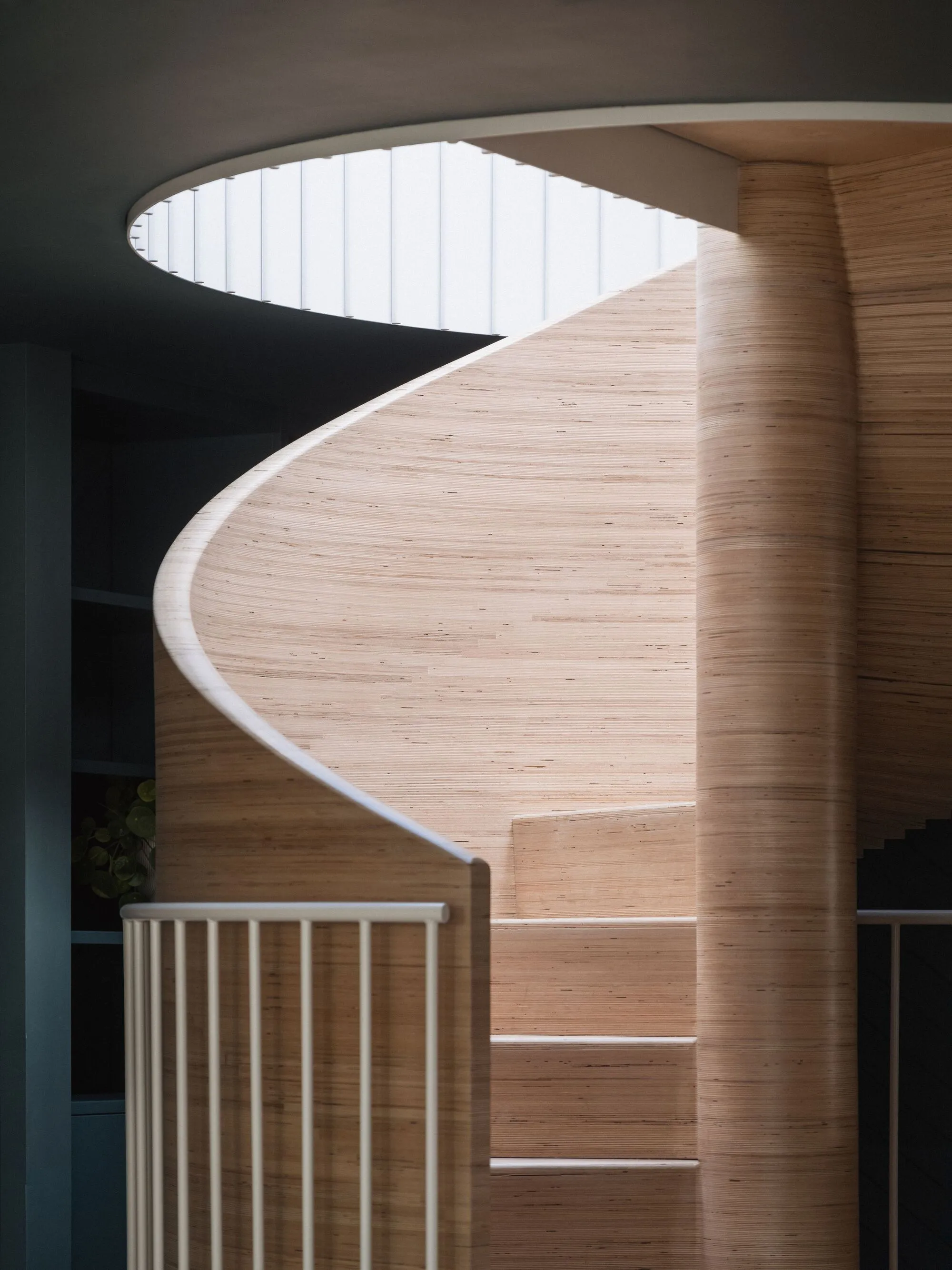 Khan Bonshek Retrofits a 1981 Postmodern Pyramid House in Milton Keynes Around a Sculptural Spiral Stair