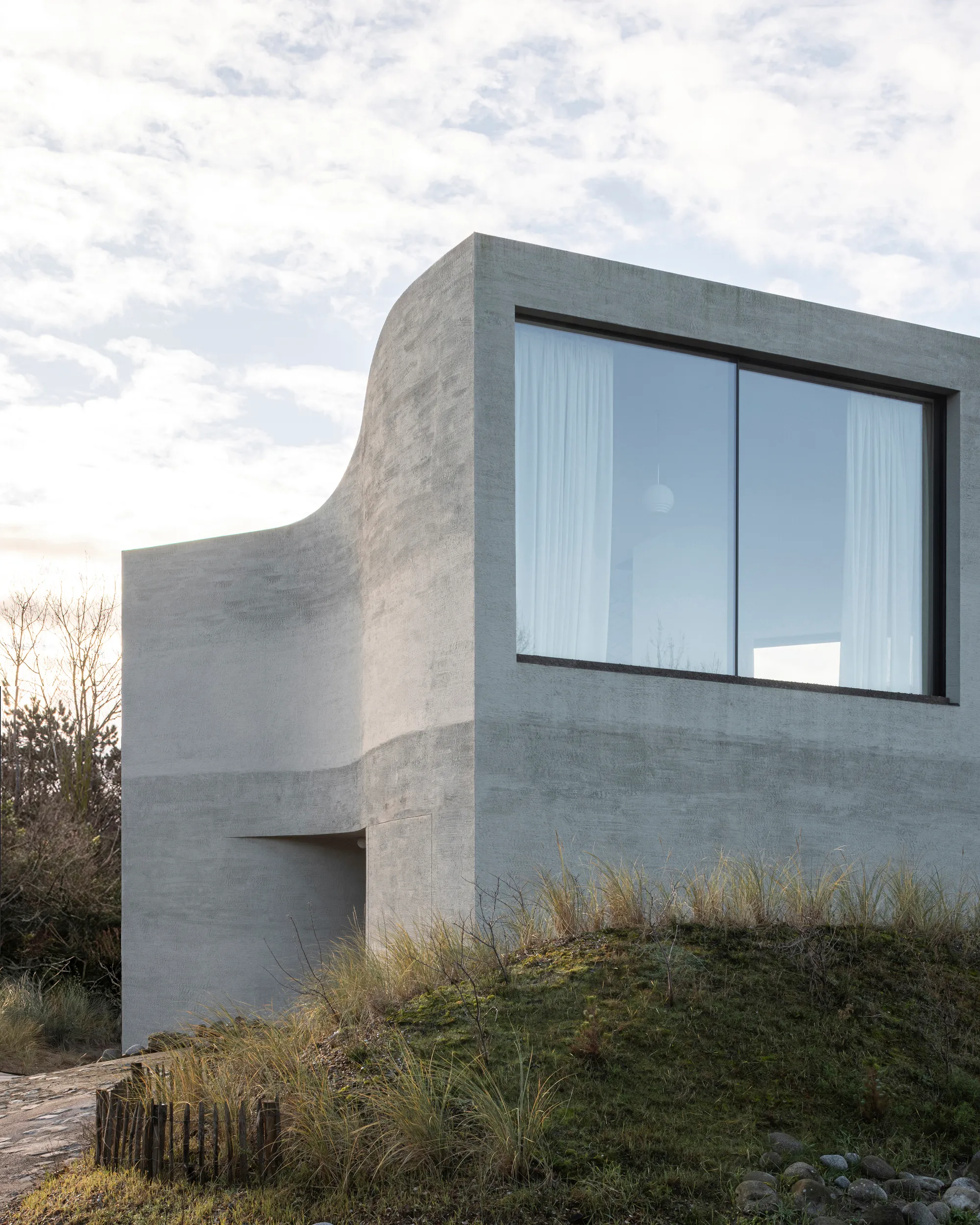 Magalie Munters Carves a Monolithic Concrete Villa into the Belgian Dunes