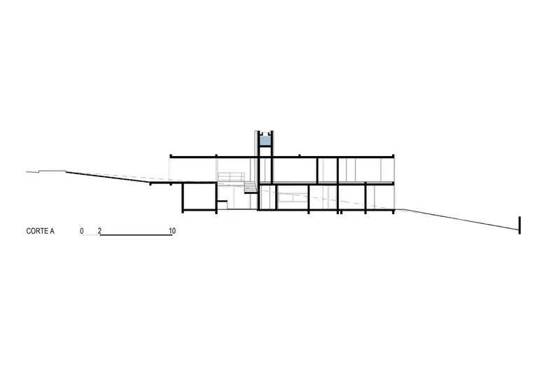 Section drawing showing two-level residence stepping down sloped terrain with central stairwell