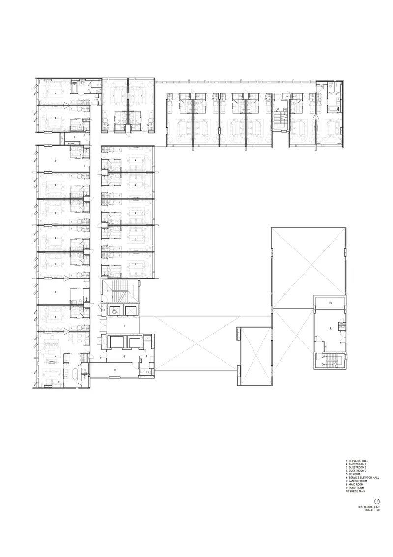 Third floor plan showing reduced footprint with penthouse units flanking the central void