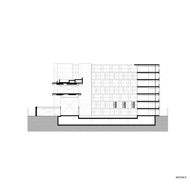 Section drawing showing volumes of varying heights with an open courtyard at lower levels