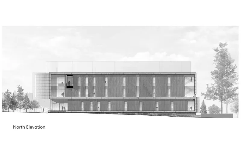 North elevation drawing showing a two-story facade with vertical window bays flanked by mature trees