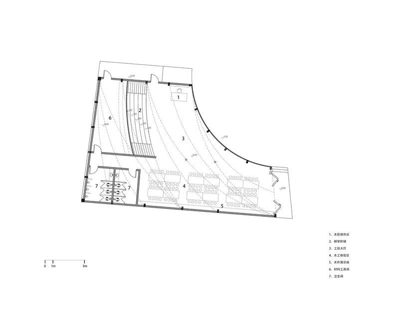 Floor plan drawing showing tiered seating hall with curved rows and adjacent circulation and service spaces