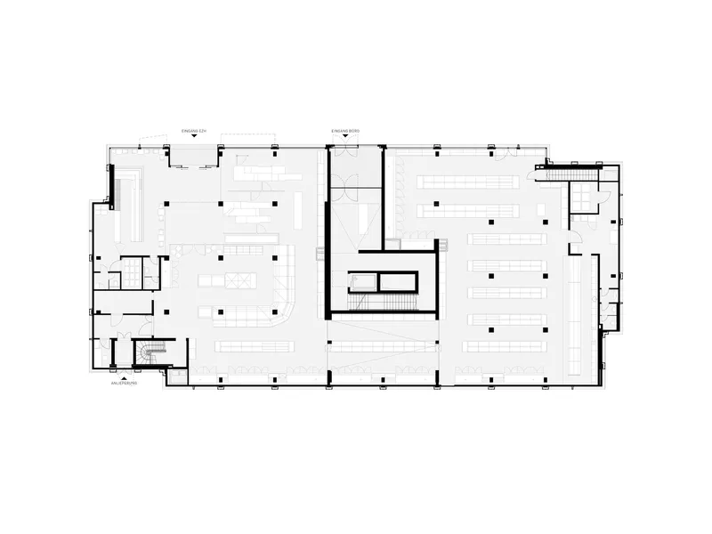 Floor plan drawing revealing large open areas flanking a central service core with support spaces