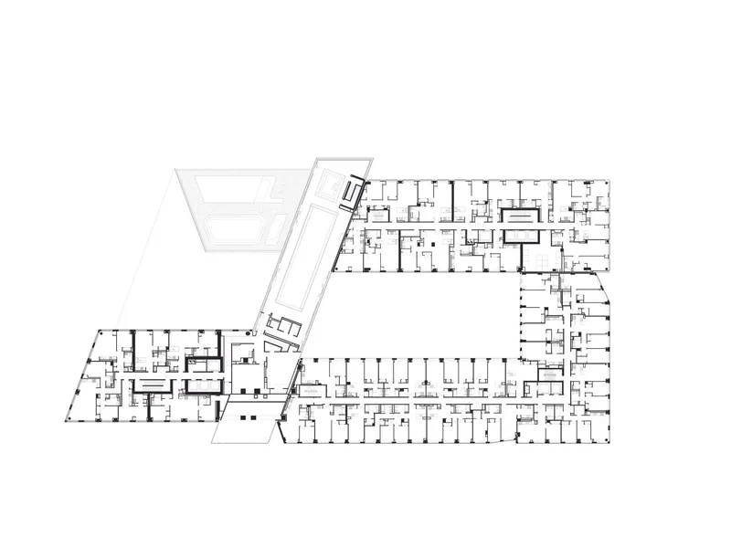 Floor plan showing residential units with an angled circulation spine connecting two building volumes