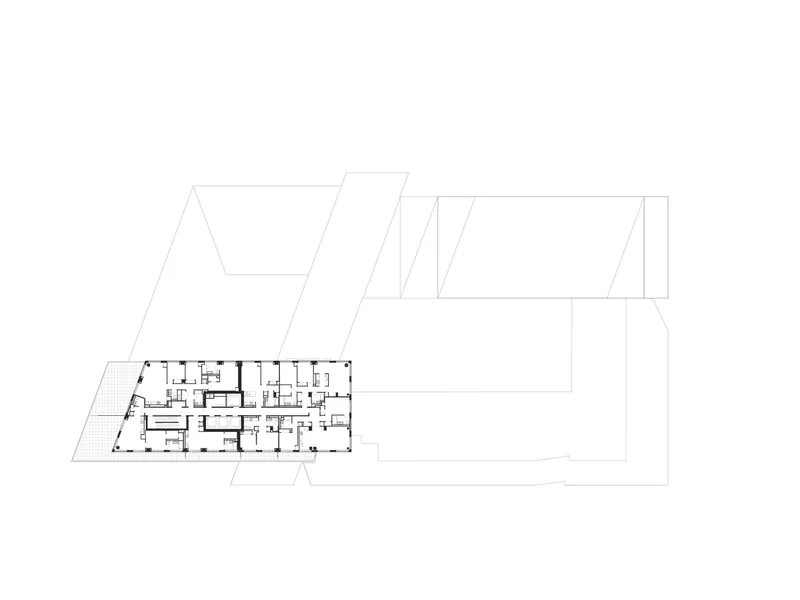 Floor plan showing single residential block with outline of adjacent tower volumes