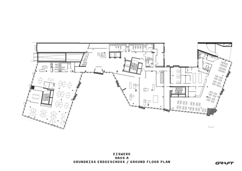 Ground floor plan drawing showing angular wings arranged around a triangular atrium with work areas