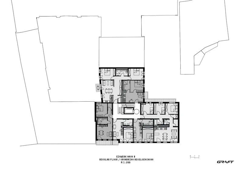 Regular floor plan drawing showing residential units arranged in an L-shaped configuration with a central circulation core