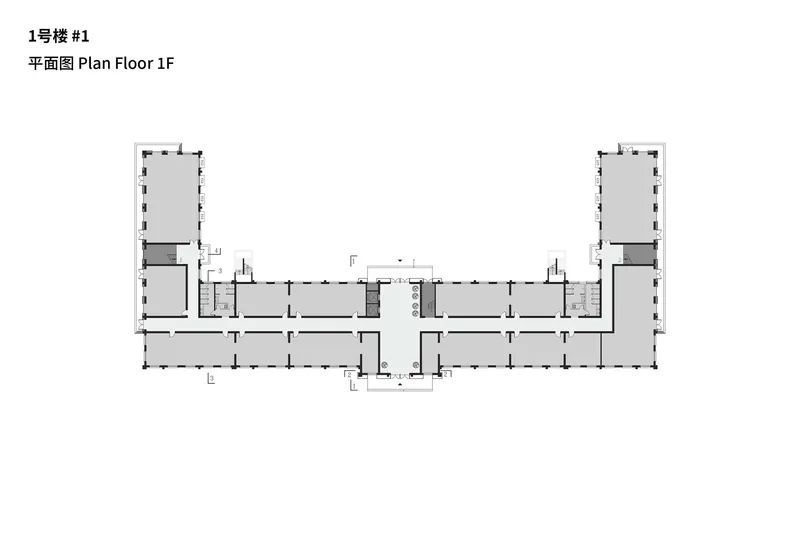 First floor plan showing a symmetrical U-shaped layout with corner pavilions and central entrance