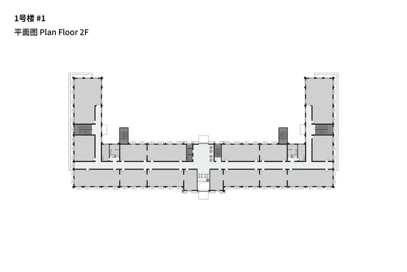 Second floor plan depicting mirrored wings flanking a central circulation core and stair volumes