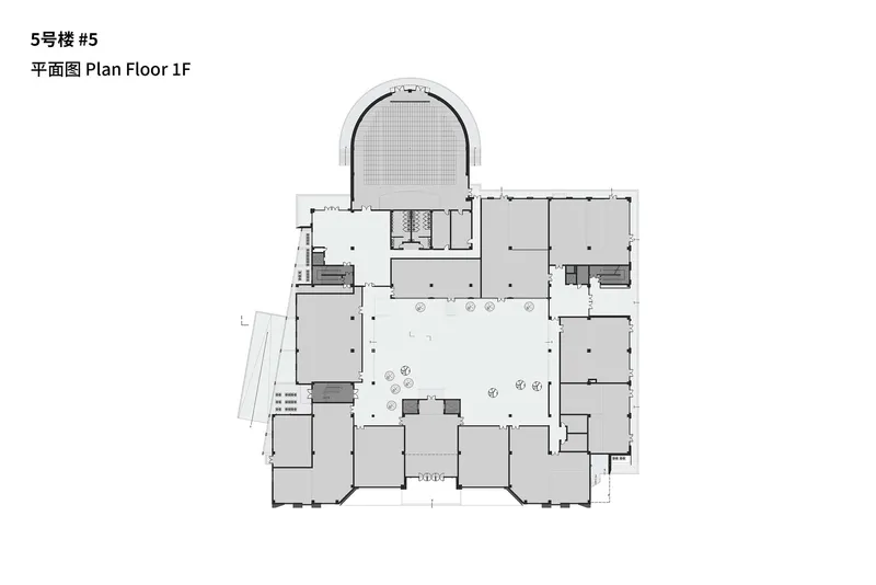First floor plan drawing showing a central courtyard with curved auditorium volume projecting at the top