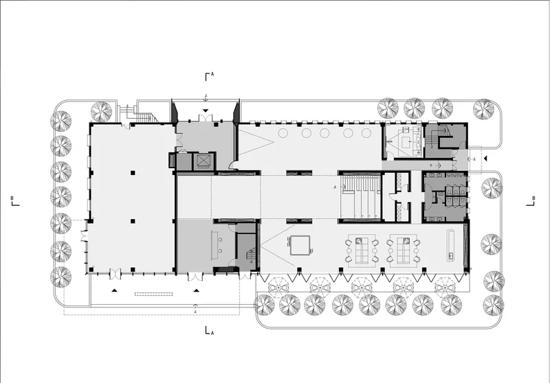 Floor plan drawing showing an open layout with perimeter trees and central gathering spaces