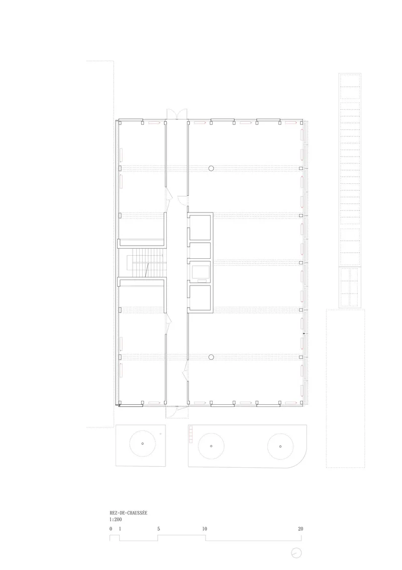 Floor plan drawing showing a rectangular layout with central stair and circulation spine