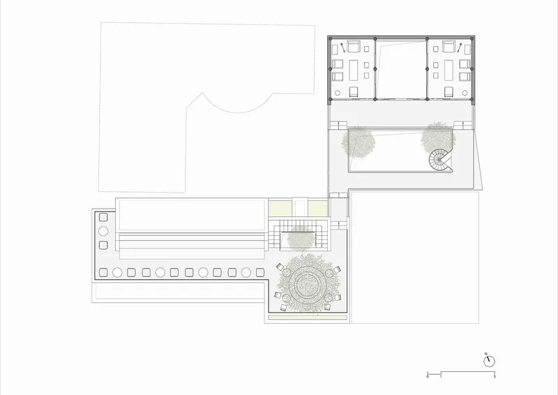 Floor plan drawing showing upper level spaces with central stairwell and courtyard plantings