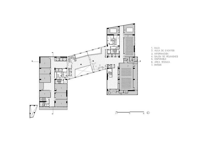 Floor plan drawing showing L-shaped wing with classrooms and a large gridded event hall