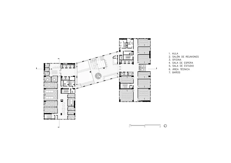 Floor plan drawing showing two wings joined by a diagonal corridor with a central courtyard