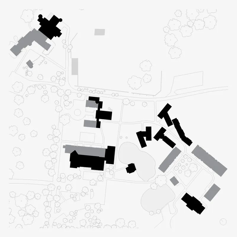 Site plan drawing showing scattered buildings and pathways with tree canopy outlines