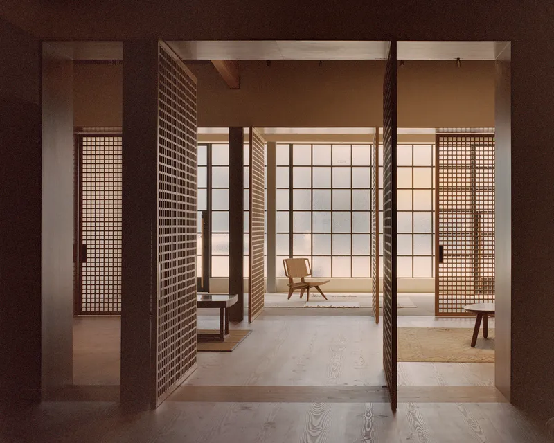 View through pivoting timber lattice screens into a softly lit room with translucent wall panels and exposed ceiling beams