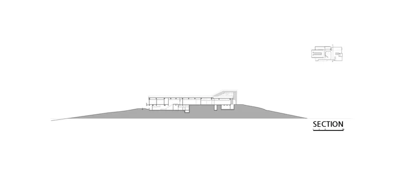 Section drawing showing the building's linear layout following the hillside gradient