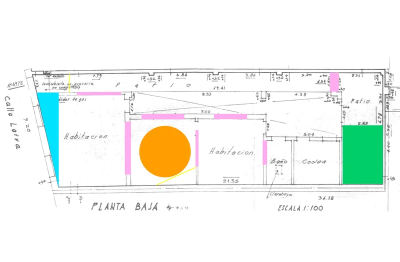 Floor plan drawing with color-coded rooms including two habitation spaces and a kitchen area