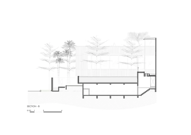 Section drawing revealing a cantilevered screen wall above a lower volume with an internal staircase