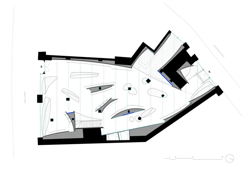 Floor plan drawing showing organic curved display elements and a central staircase within an angled perimeter