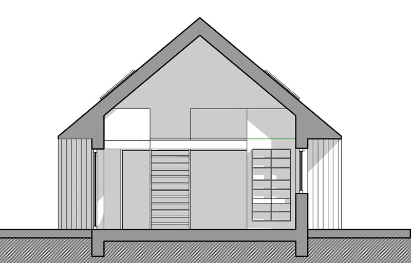 Section drawing revealing interior spaces beneath the pitched roof with a stair and partial mezzanine level