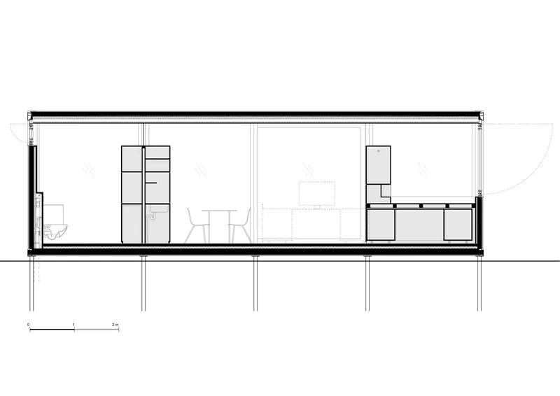 Section drawing showing single-story volume on pilotis with built-in storage units flanking living area