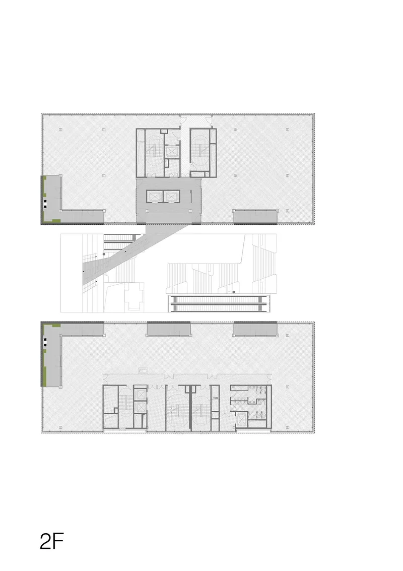 Floor plan showing two levels with central service cores and open flexible spaces with diagonal stair connection