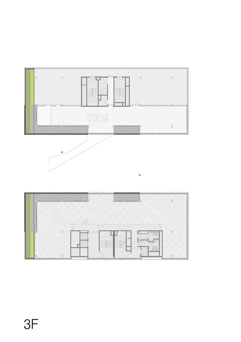 Floor plan illustrating two levels with central service cores and open areas with diagonal entry ramp