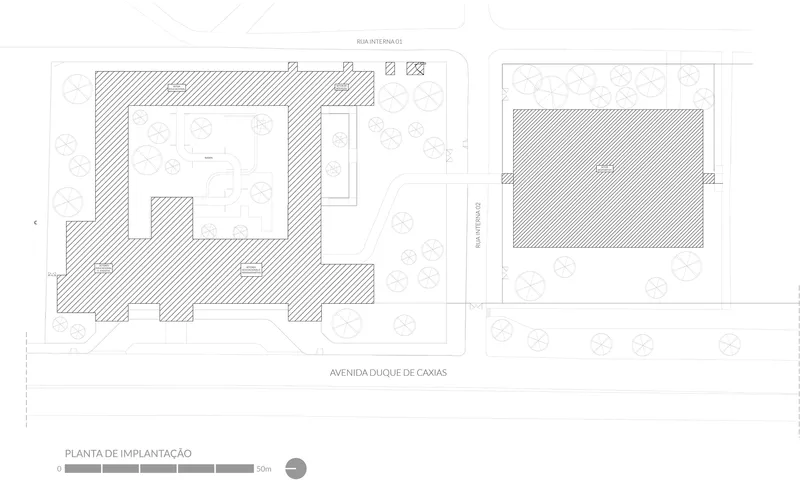 Site plan drawing showing two buildings with hatched footprints surrounded by circular tree symbols