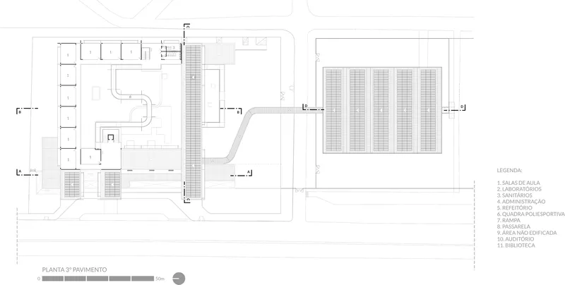 Ground floor plan drawing showing two building volumes connected by a curved pathway and adjacent solar panel array