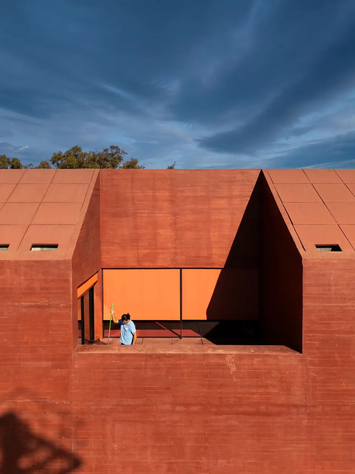 Spaceworkers Anchors a Red Concrete Museum to the Algarve Cliffs at Vila do Bispo