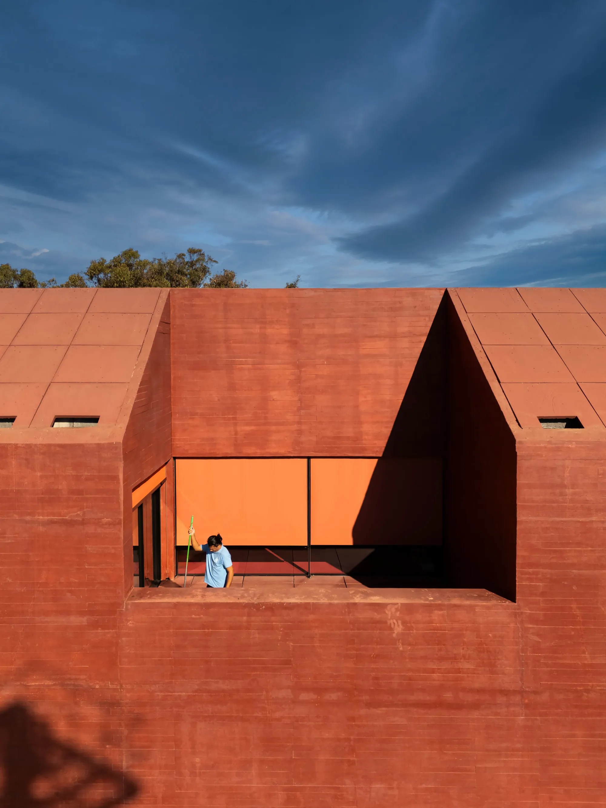 Spaceworkers Anchors a Red Concrete Museum to the Algarve Cliffs at Vila do Bispo