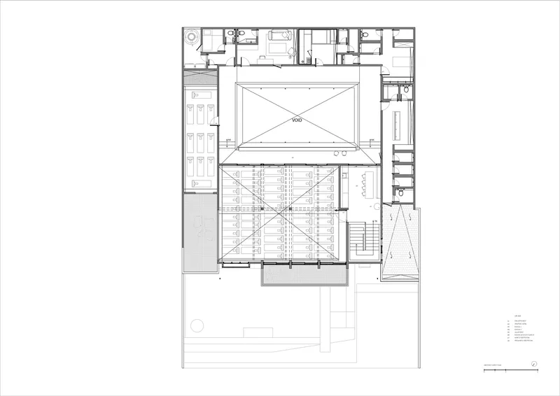 Upper floor plan depicting a central double-height space with cross-bracing surrounded by perimeter rooms