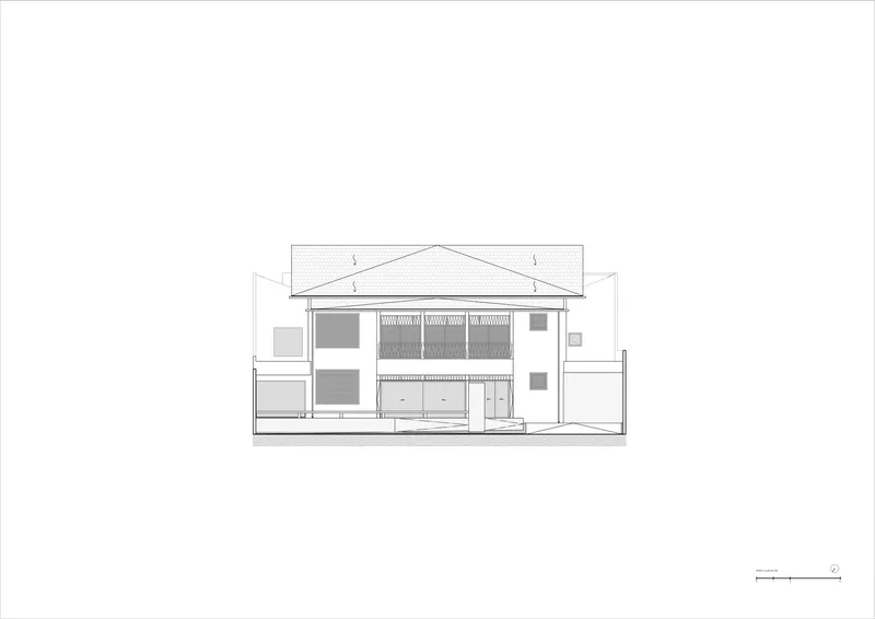 Section drawing cutting through the two-story volume showing the pitched roof and interior spatial relationships