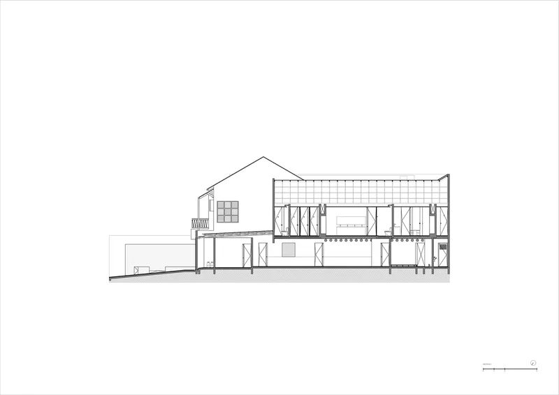 Section drawing displaying a gabled roof volume with exposed truss system and double-height glazed space