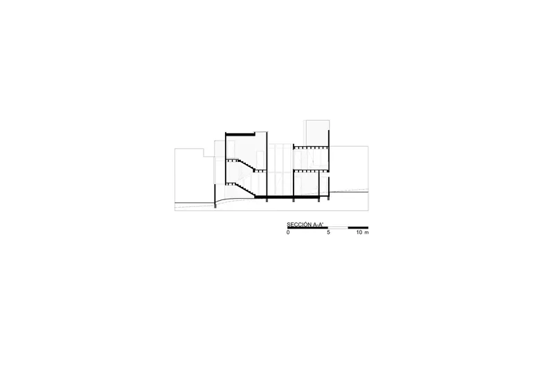 Section drawing showing split-level interior spaces with stairs connecting ground and upper floors